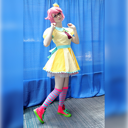 Cosplay; person in yellow dress and pink hair