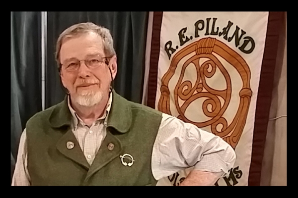 Rob Piland photo with brooch and banner